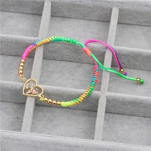 Rainbow braided rope bracelet with gold zircon heart charm and adjustable knot