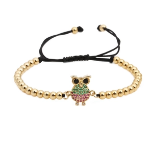 Adjustable woven bracelet with gold beads and micro-pave zircon owl charm in green and pink