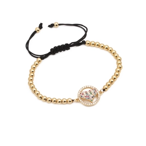 Adjustable woven bracelet with gold beads and micro-paved rainbow zircon heart pendant