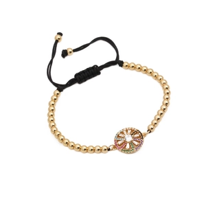 Adjustable woven bracelet with gold beads and a colorful zircon inlaid circular charm