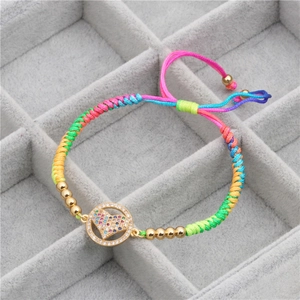 Rainbow braided friendship bracelet with heart-shaped CZ golden pendant for women