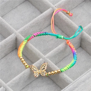 Handmade rainbow braided butterfly bracelet with gold accents and colorful zircon stones