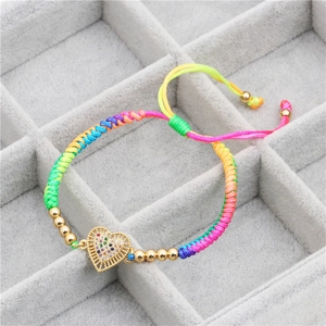 Rainbow woven friendship bracelet with golden hollow heart and colorful zircon stones