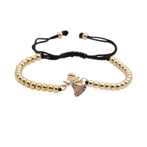 Detail of woven bracelet with gold beads and colorful zircon angel pendant charms