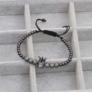 Close-up of braided crown bracelet featuring micro-pave zircon balls and beads