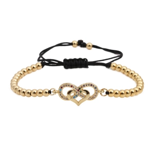 Bracelet réglable en perles dorées avec cœur en zircone coloré et symbole infini