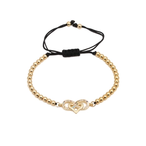 Bracelet tressé à perles dorées avec cœurs entrelacés et zircons multicolores