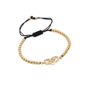 Bracelet ajustable perles dorées avec breloque cœur infini et cordon noir tressé