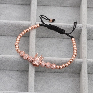 Detail of rose gold crown charm with micro-pave cubic zirconia on adjustable cord