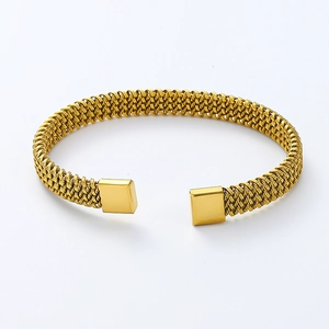Detailed close-up of 18K gold-plated braided mesh texture on the stainless steel cuff