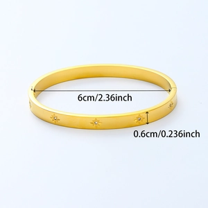 Gold stainless steel bangle featuring star patterns and zircon stones with 6cm diameter