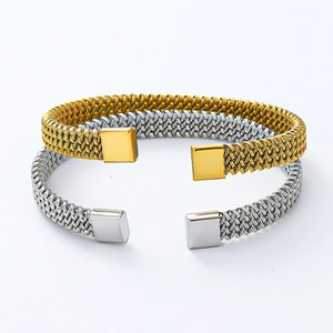 Detailed view of twisted woven mesh open bangles in gold and silver stainless steel