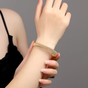 Chic 18K gold plated stainless steel mesh twisted cuff bracelet for couples on model wrist