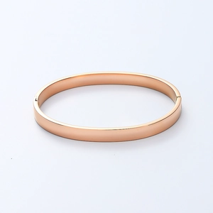 Close-up of a 6mm rose gold polished titanium steel bangle with a hinge clasp mechanism