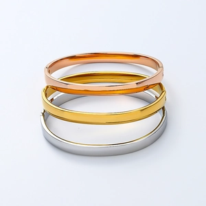 Detailed close-up of 6mm curved titanium steel bracelets in rose gold, gold and silver