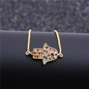Luxury gold Hamsa hand bracelet featuring colorful pavé-set zircons and a box chain link