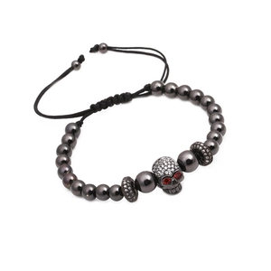 Adjustable punk beaded bracelet with zircon-encrusted skull and red gemstone eyes