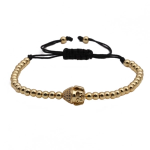 Bracciale intrecciato regolabile con perline di rame dorato e ciondolo testa di Buddha