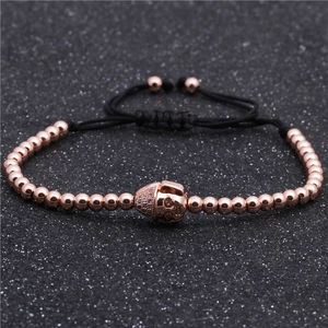 Bracciale regolabile in perline oro rosa con teschio di cristalli su cordino nero
