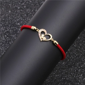 Red braided cord bracelet with gold heart charm and micro-pave crystals for couples