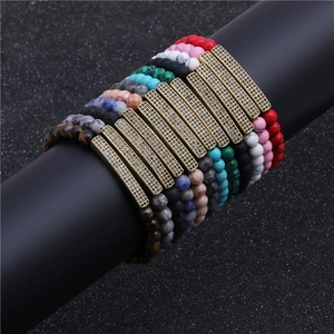 Vue détaillée de bracelets de 6mm en oeil de tigre et turquoise avec tube en métal zircon
