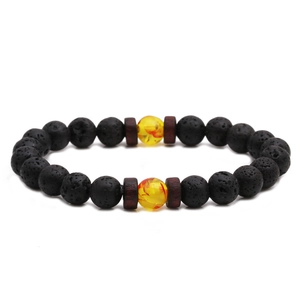 Handgefertigtes Armband aus schwarzem Lavastein mit gelben Harzperlen und Holz-Zwischenstücken