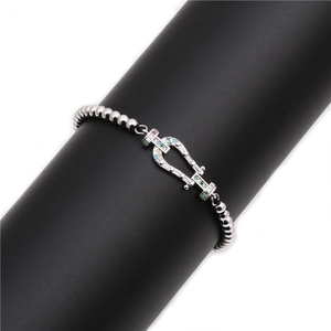Silver bead bracelet featuring a horseshoe clasp with colorful micro-pave zircons