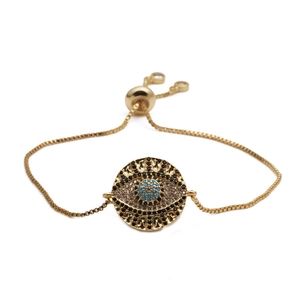 Adjustable evil eye bracelet in gold finish with blue and black zircon stones