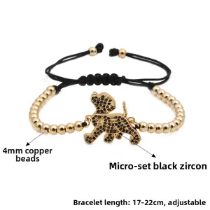 Detail of dog-shaped pendant bracelet with micro-pave black cubic zirconia and 4mm gold beads