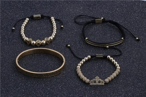 Men's 4-piece luxury gold bracelet set featuring Roman numeral cuff and crown beads