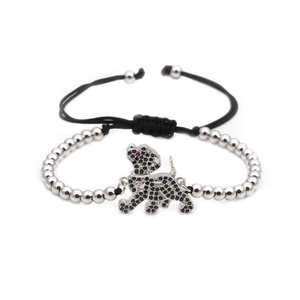 Adjustable woven bracelet with silver beads and a dog charm pavé-set with black cubic zirconia