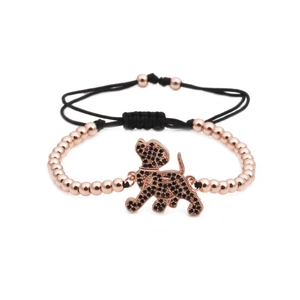 Adjustable rose gold beaded bracelet featuring a puppy dog charm with black zircon stones