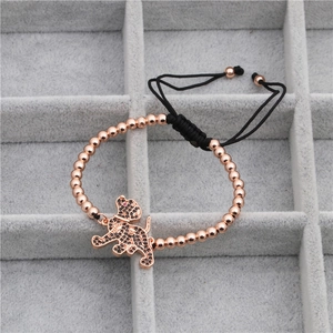Adjustable rose gold bead bracelet with a black zircon puppy pendant on a woven cord