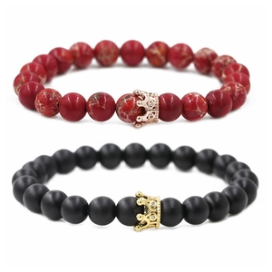 Detail view of red emperor stone and matte black beads with micro-pave zircon crowns