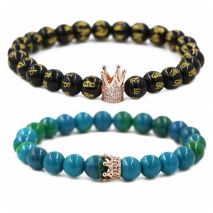 Beaded crown bracelets with six-word mantra symbols in black and turquoise colors