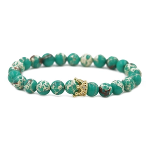 Detailed close-up of 8mm marble texture stone beads with a golden crown charm bracelet