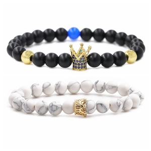 Set of two 8mm beaded bracelets with matte black stone, white turquoise, and golden crowns