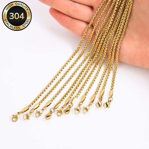 Close-up of 304 stainless steel flat pearl necklaces in gold finish with lobster clasp
