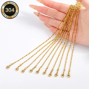 Pack of 10 gold 304 stainless steel chain necklaces with lobster clasp held by hand