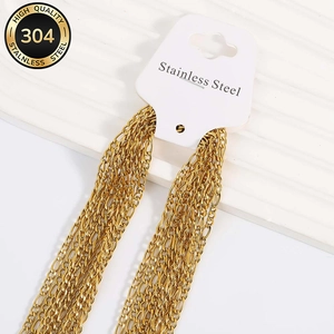 Close-up of 18K gold plated 304 stainless steel Figaro chain links with Lobster clasp