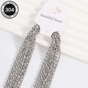 Detailed macro view of 304 stainless steel bead chains with lobster clasps on display card