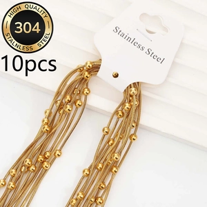 Macro shot of gold-plated 304 stainless steel snake chains with lobster clasps