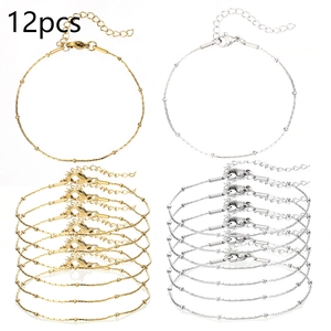 Detailed view of 12pcs gold and silver beaded chain bracelets with lobster clasps