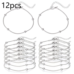Macro shot of 12pcs silver snake chain bracelets with lobster clasp and five beads
