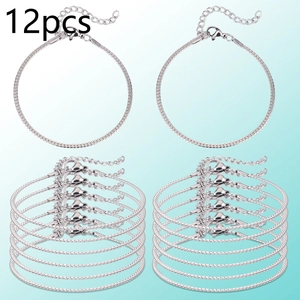 Detail of 12-piece silver snake chain bracelet set with lobster clasps and extenders