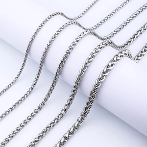 Detail showing five thickness levels of stainless steel wheat chains with metallic luster