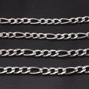 Polished stainless steel Figaro chain necklace for men on black leather surface