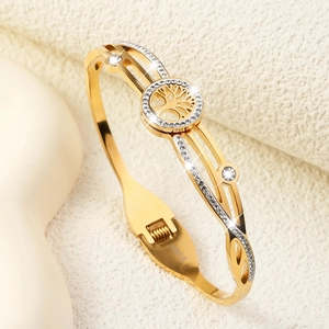 Detail of gold Tree of Life bracelet featuring pavé crystals and spring hinge clasp