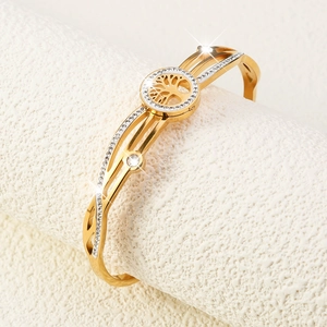 Gold titanium steel tree of life bangle with hollow design and sparkling diamonds