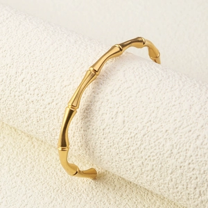 Minimalist 18K gold bamboo joint open cuff bracelet with polished naturalistic design